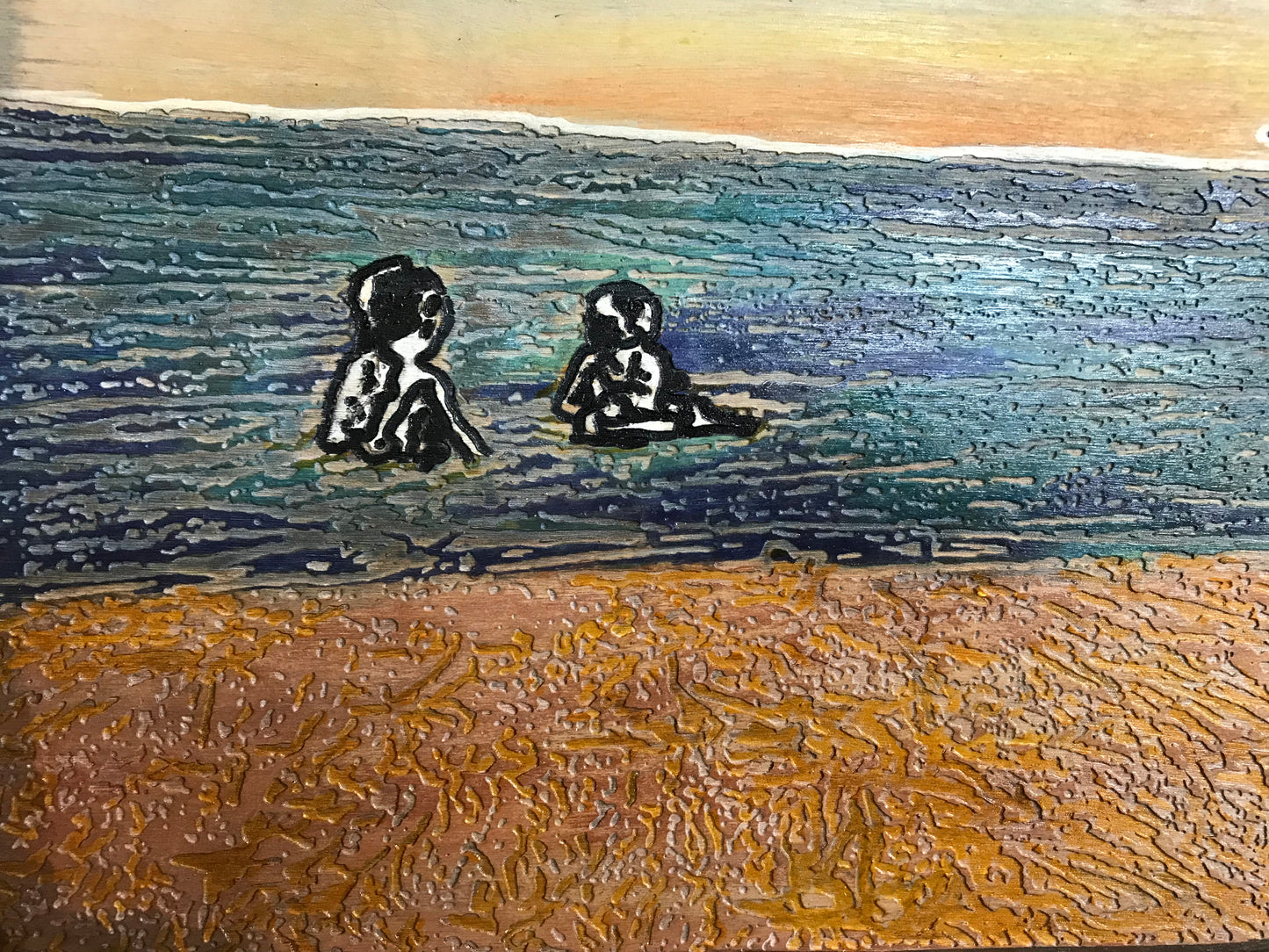 Kids in water at sunset