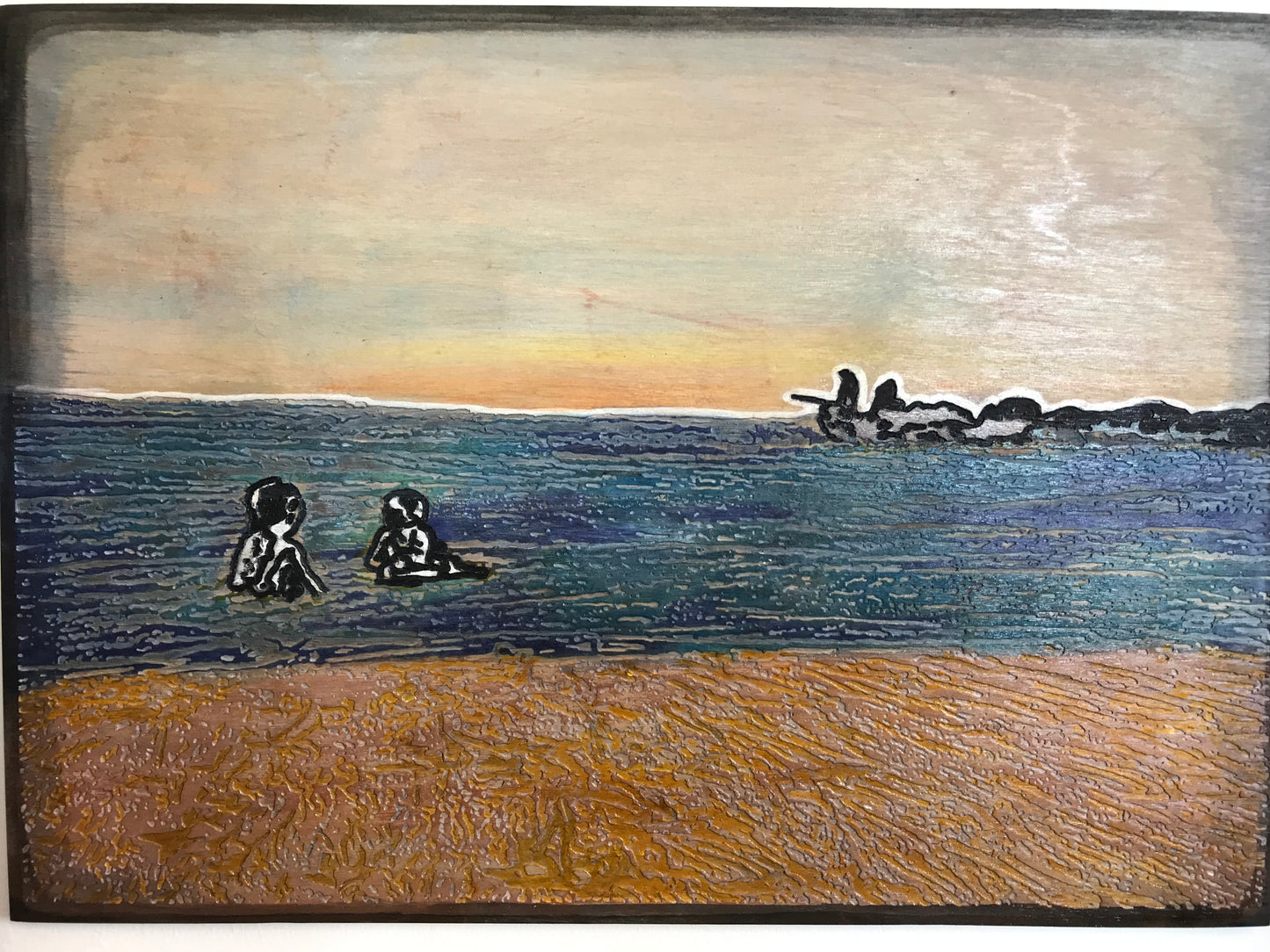Kids in water at sunset
